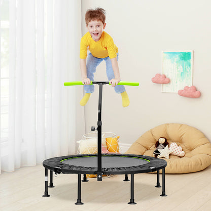 The green mini trampoline with adjustable handrail is set up in a living room with a child bouncing
