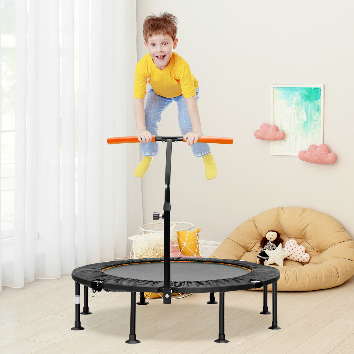 The mini trampoline placed in a child's bedroom with a boy jumping on the mat