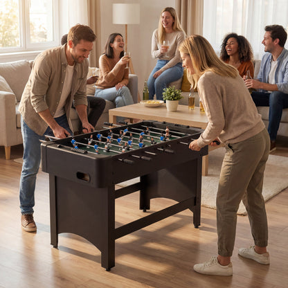 the soccer game table being used by two people in a bright living room with friends