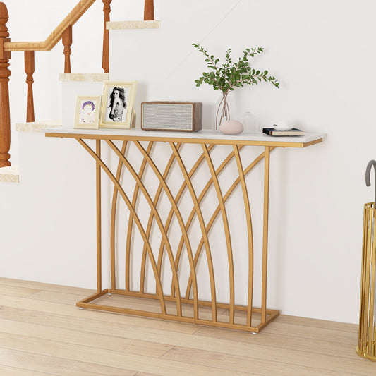 The console table placed in a hallway with decorative items and a wooden staircase in the background
