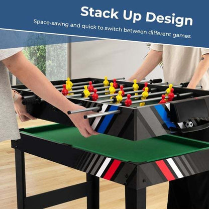 Hands stacking the foosball game layer onto the multi games table