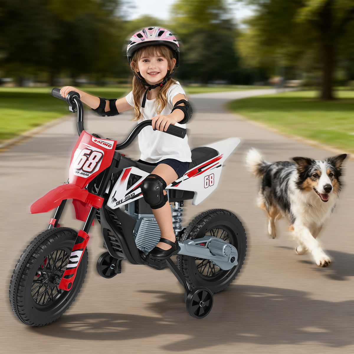 Young girl riding the red and white kids electric motorbike with a dog running alongside