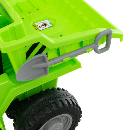 Close-up of the green kids electric dump truck's rear dump bed and attached shovel