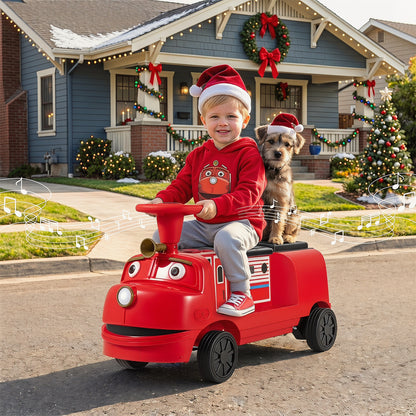 The kids electric train with a child and a dog wearing festive hats in front of a decorated house