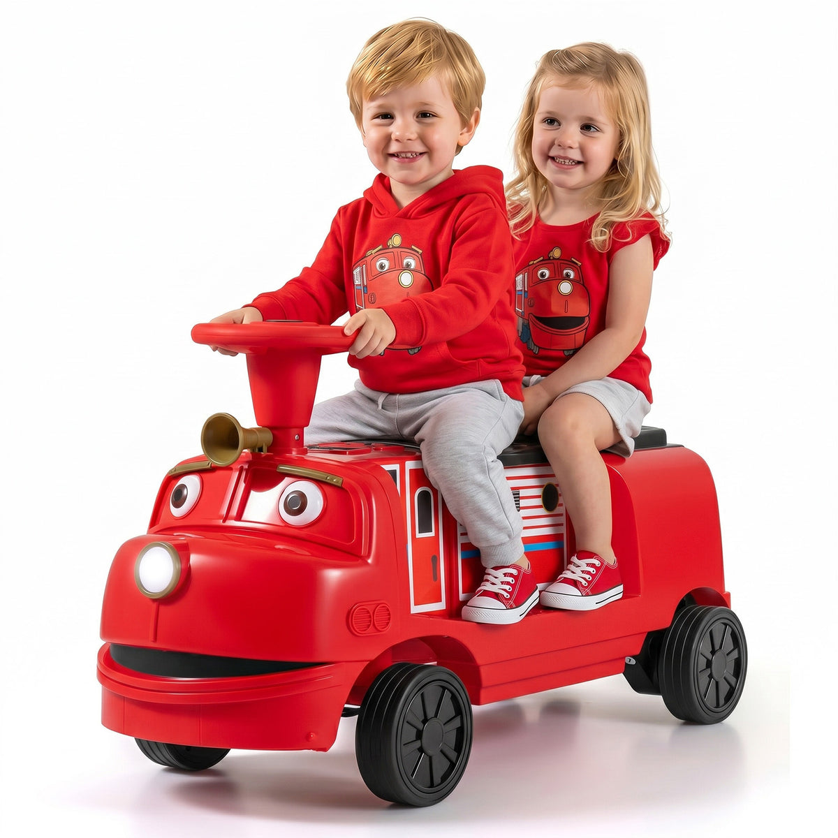 The kids electric train with two young children sitting together on the red plastic seat
