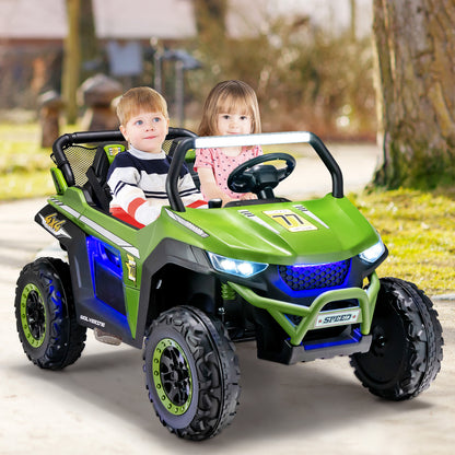 A green kids electric car with two children riding in it on a paved path outdoors