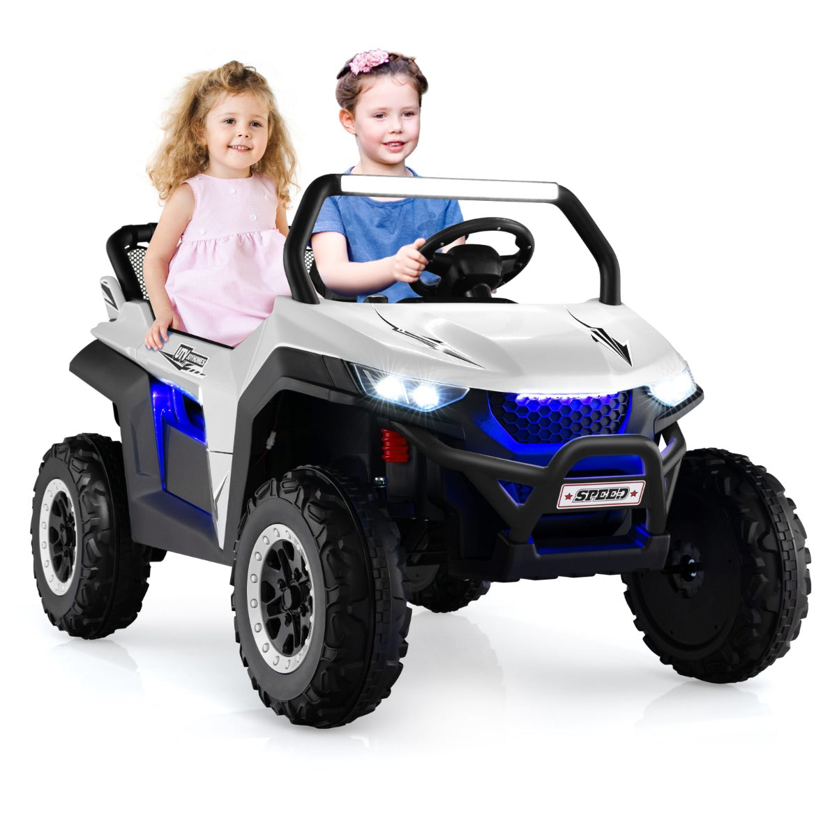 Two children sitting in the white electric UTV on a paved path with a park bench behind