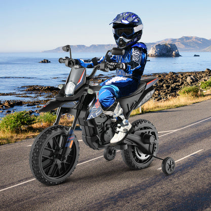 Child wearing a blue helmet and suit rides the kids electric motorbike on a coastal road