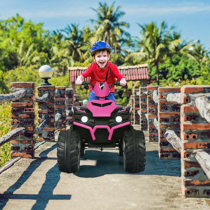A young boy wearing a blue helmet rides the pink electric quad bike on a bridge