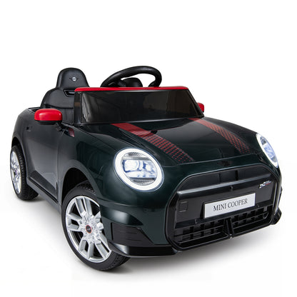 The black kids electric car is parked on a paved surface with a red trim detail