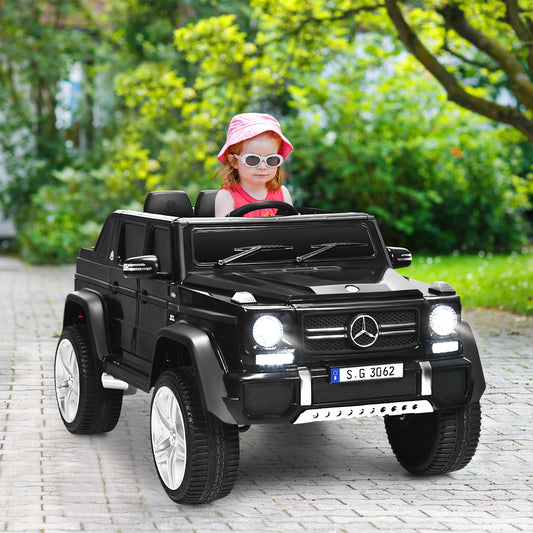 A young girl wearing a pink hat rides the black electric car outdoors