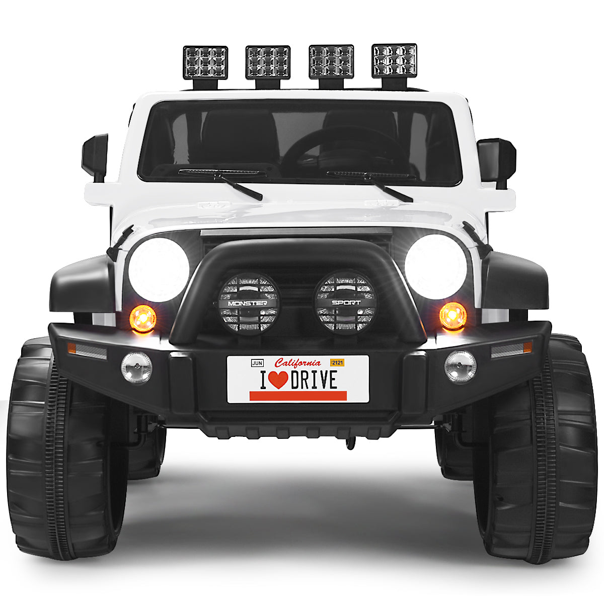 Close-up front view of the white electric ride on truck, highlighting its grille and lights