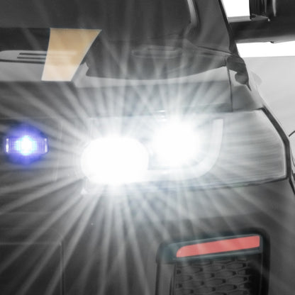 12V Kid Ride on Police Car, the kids electric car showing a close-up of the bright white LED headlight shining