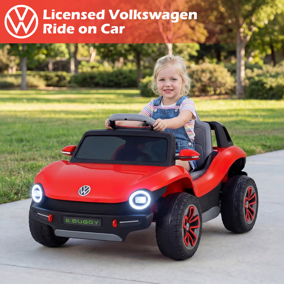 A happy toddler sits in the red licensed Volkswagen electric car