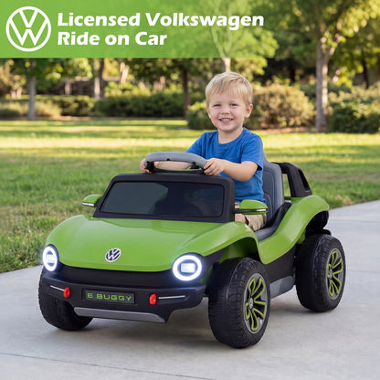 The kids electric car with a young boy sitting in the driver seat on a sunny day