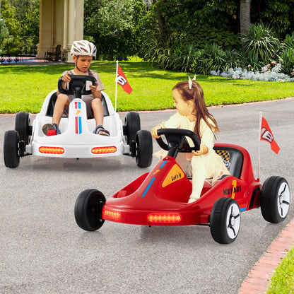 Two kids riding white and red electric go karts on a paved path