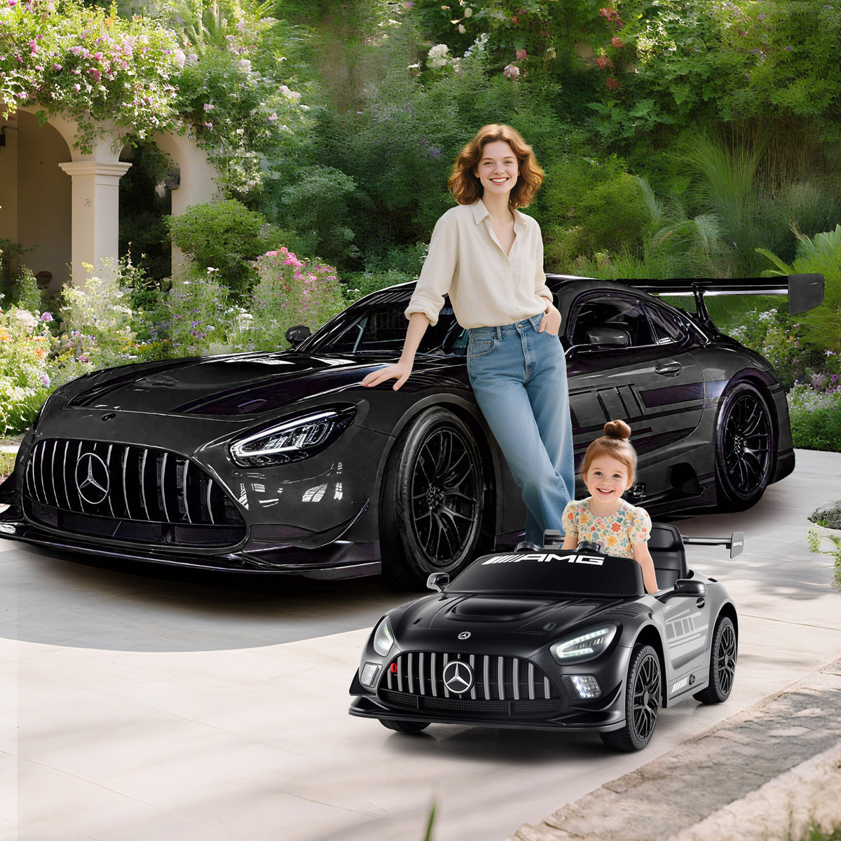 Mother and child with the black kids electric car Benz GT3 in a garden setting