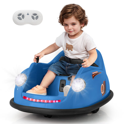 A young boy driving the navy blue ride on car with a remote control
