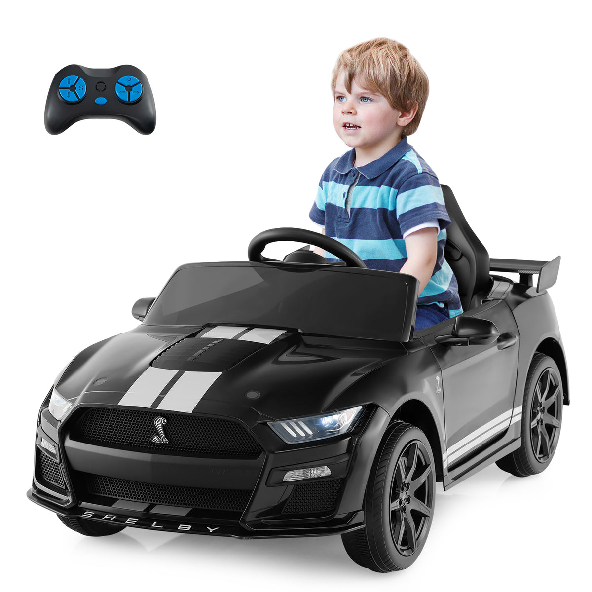 A young boy driving the black kids electric car on a paved surface
