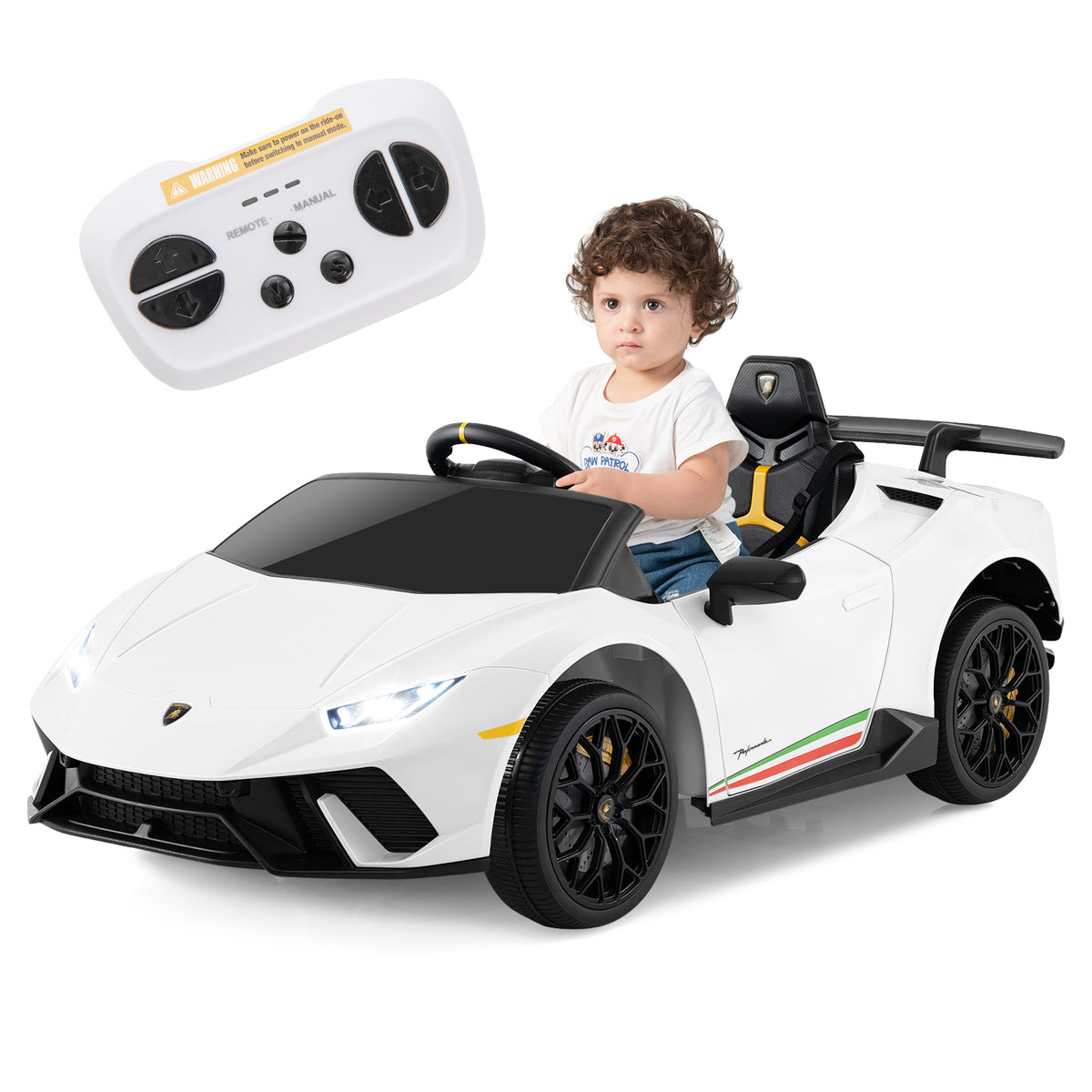 A toddler sits in the white kids electric car Lamborghini with a remote control nearby