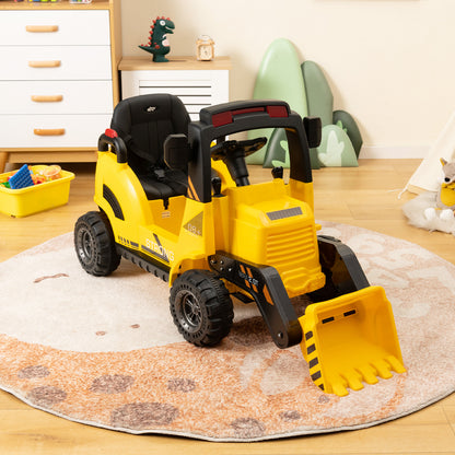 Yellow kids electric tractor with a bucket and steering wheel in a room
