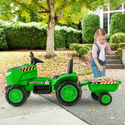 The kids electric car with a girl filling the detachable trailer with autumn leaves