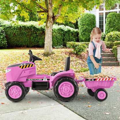 The kids electric car with a girl putting autumn leaves into the attached trailer
