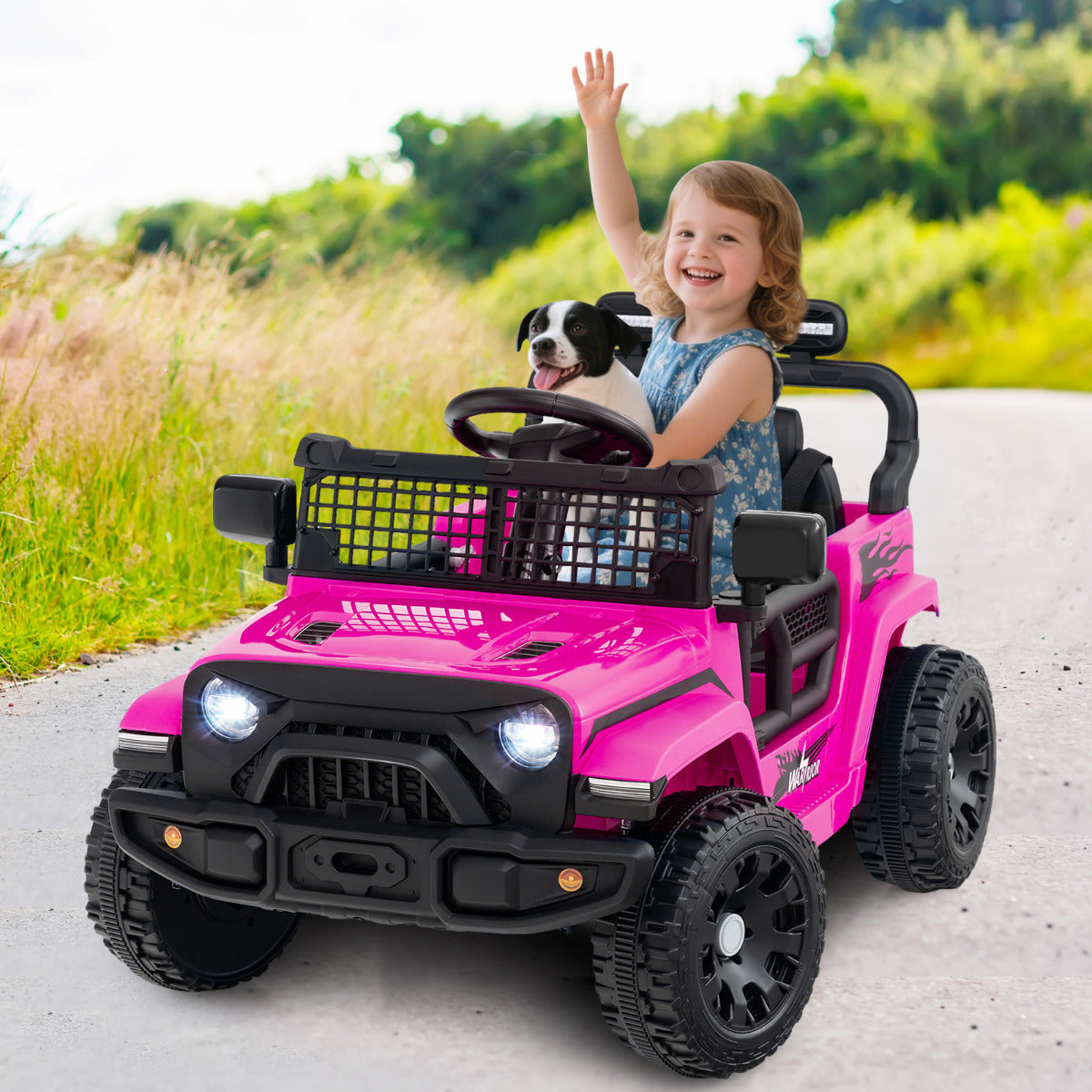 A pink kids electric truck car with a child waving from the driver's seat