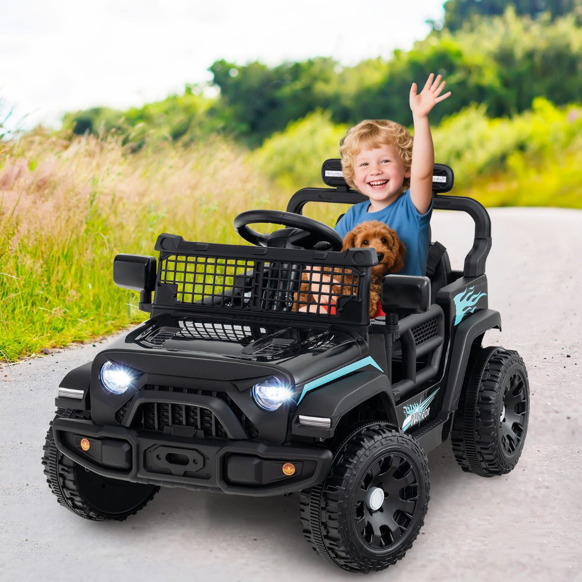 A child and a dog ride in the black 12V Kids Ride on Truck Car on a country road