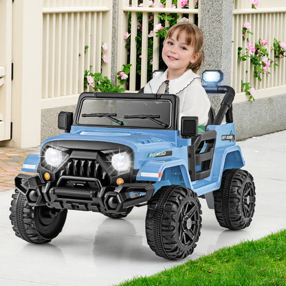A young girl sits in the blue kids electric truck on a paved path