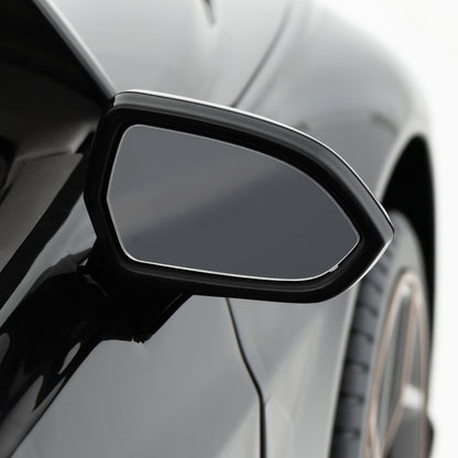 The side mirror of the black Bentley Bacalar kids electric car