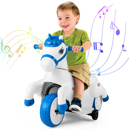 A boy happily riding the blue and white electric unicorn toy with music notes
