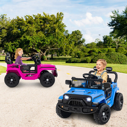 Two kids electric truck cars, one pink and one blue, on a paved path with children driving