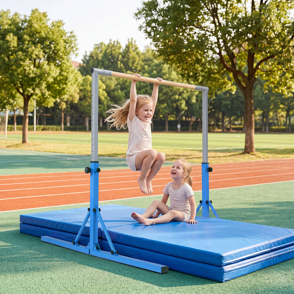 the gymnastics bar set up on a running track with two children playing on the blue mat