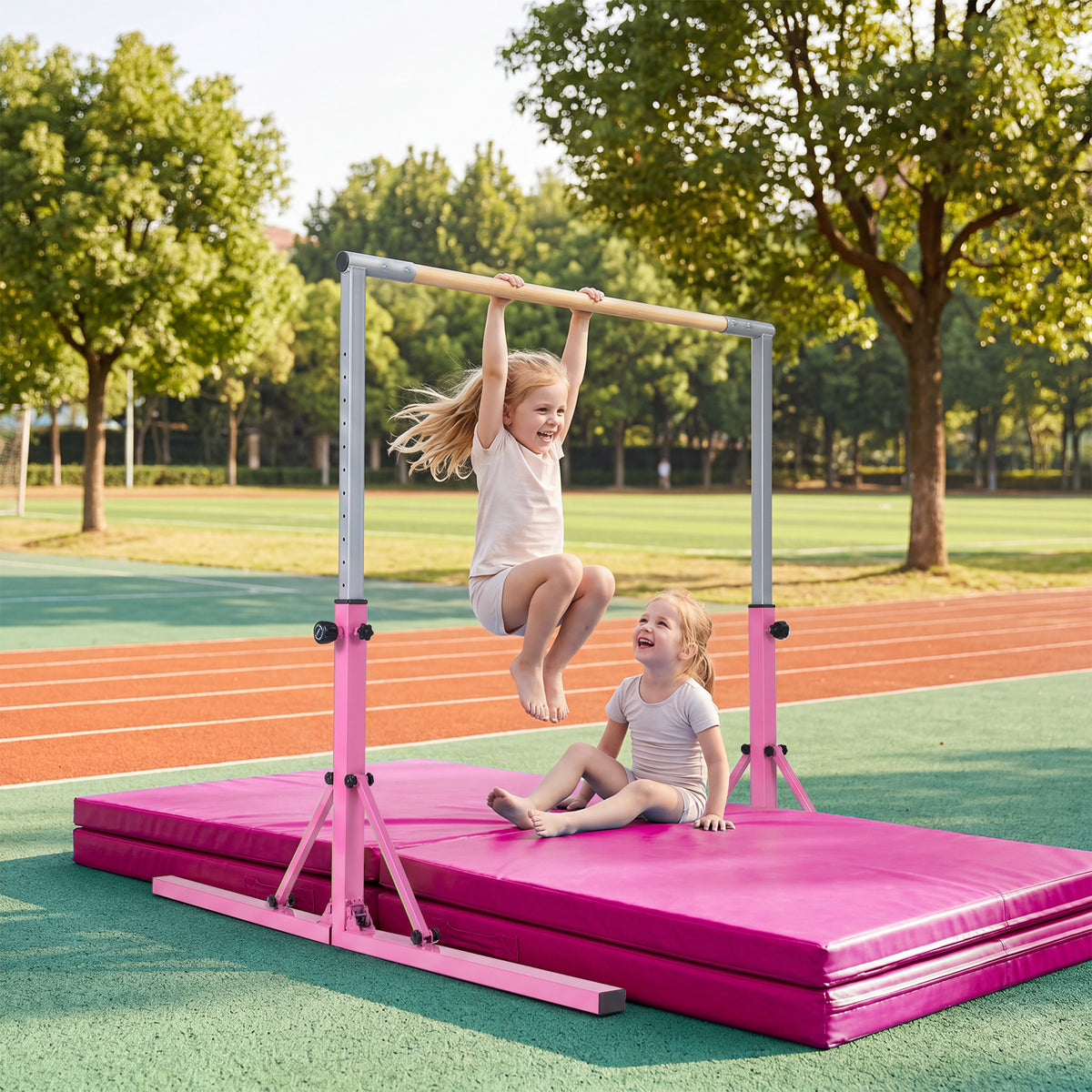 The pink foldable gymnastics bar with two children playing on mats outdoors