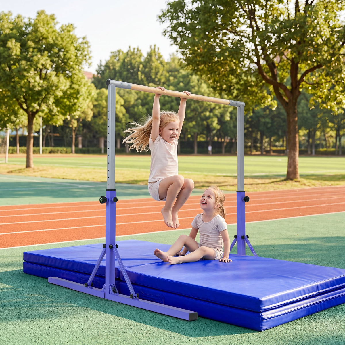 Two young girls using the purple gymnastics bar on mats outdoors