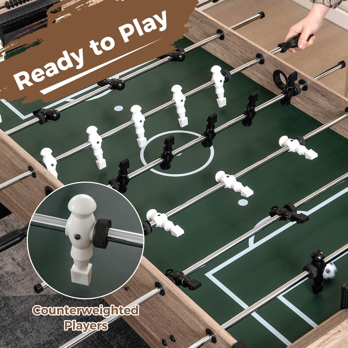The soccer game table showing a close-up of the counterweighted player figures
