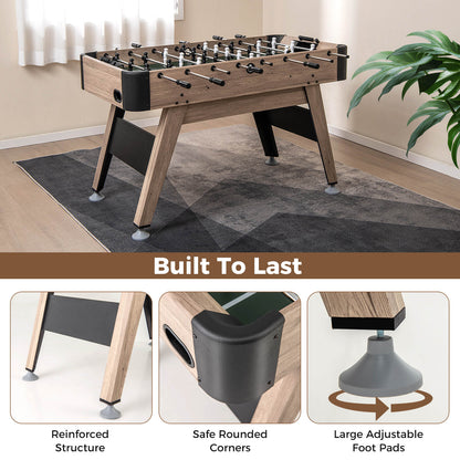 The soccer game table in a room with close-ups of the feet and corner design