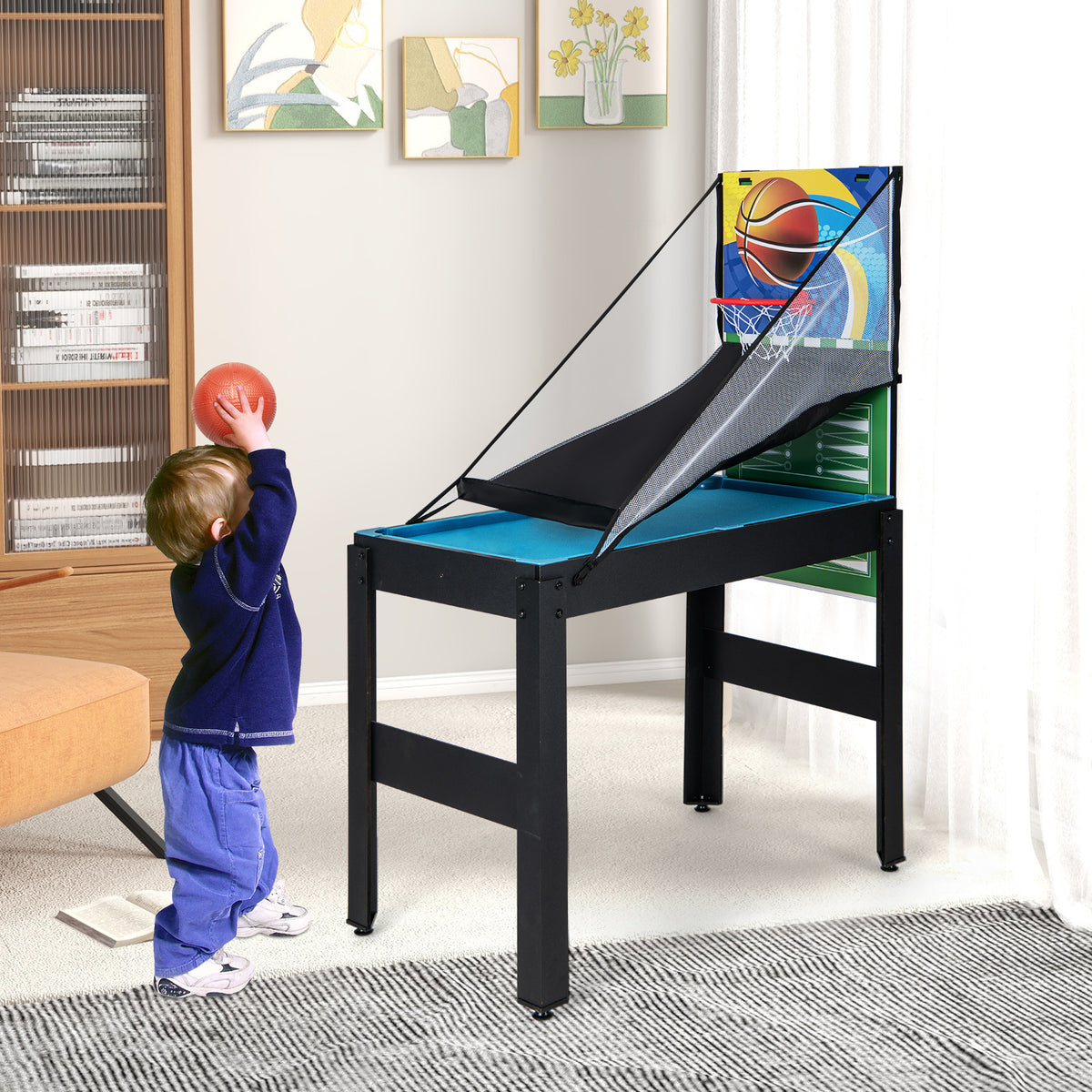 The game table set up for basketball with a child preparing to throw the ball