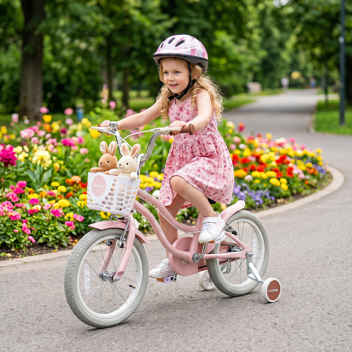 Girl riding the pink retro series kids bike past flowers
