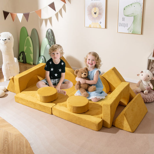 Two children playing on the yellow modular kids play couch in a room with cartoon animal pictures
