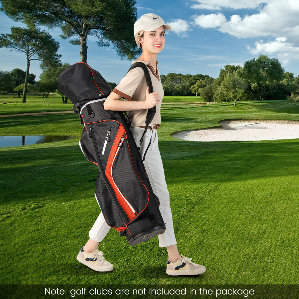 The golf bag carried over the shoulder by a woman walking on a green golf course