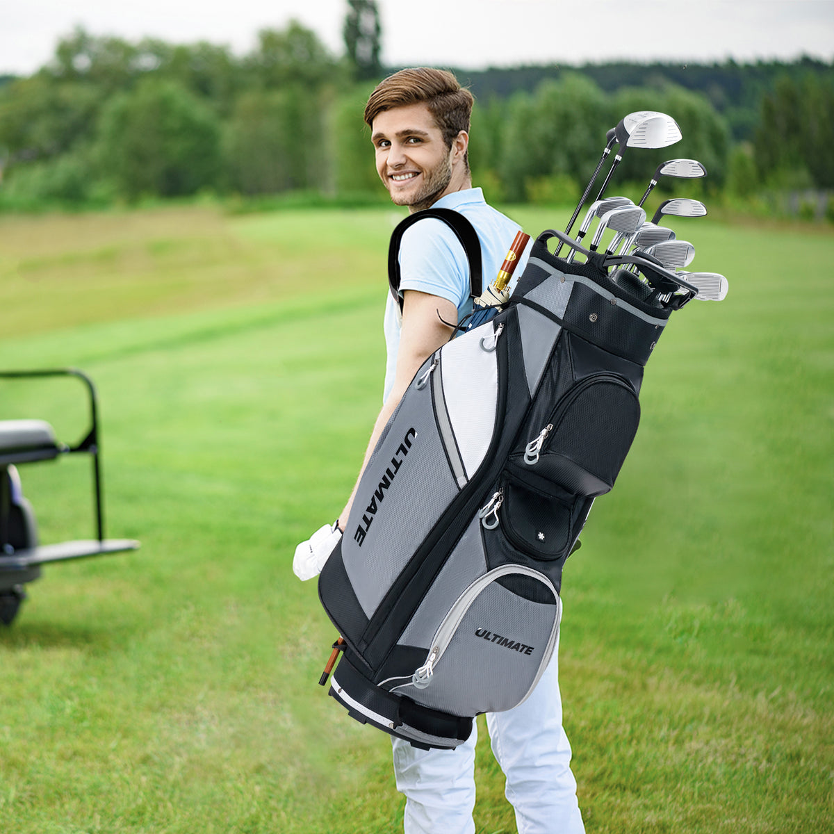 Man carrying the golf cart bag on a golf course