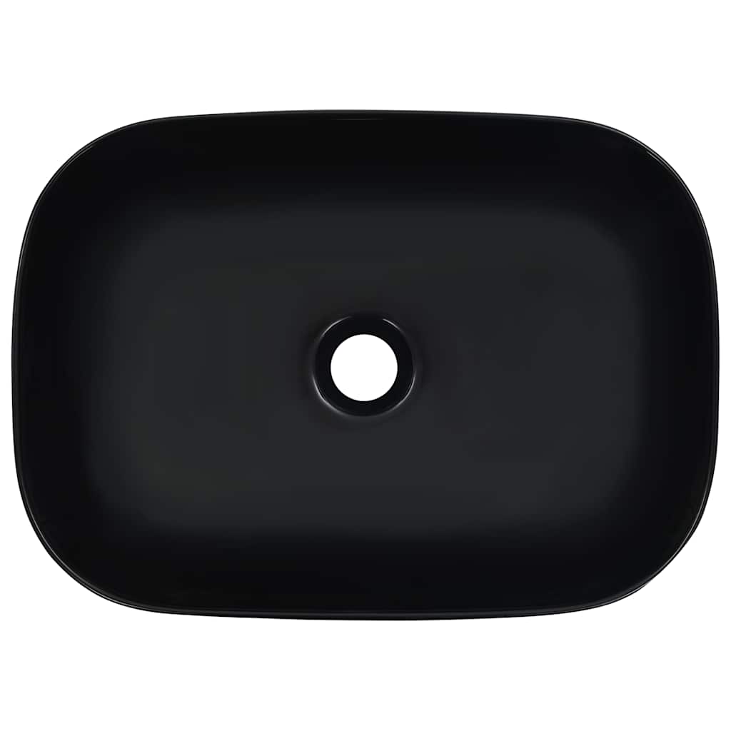 the black ceramic basin, viewed from directly above showing the drain hole