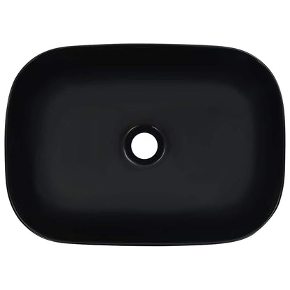 the black ceramic basin, viewed from directly above showing the drain hole