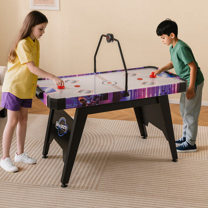 Children playing air hockey on a white and purple table in a living room