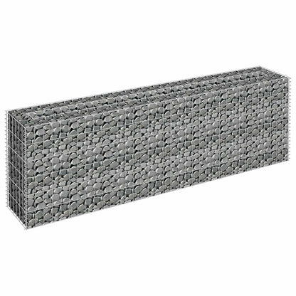 A galvanised raised garden bed filled with stones