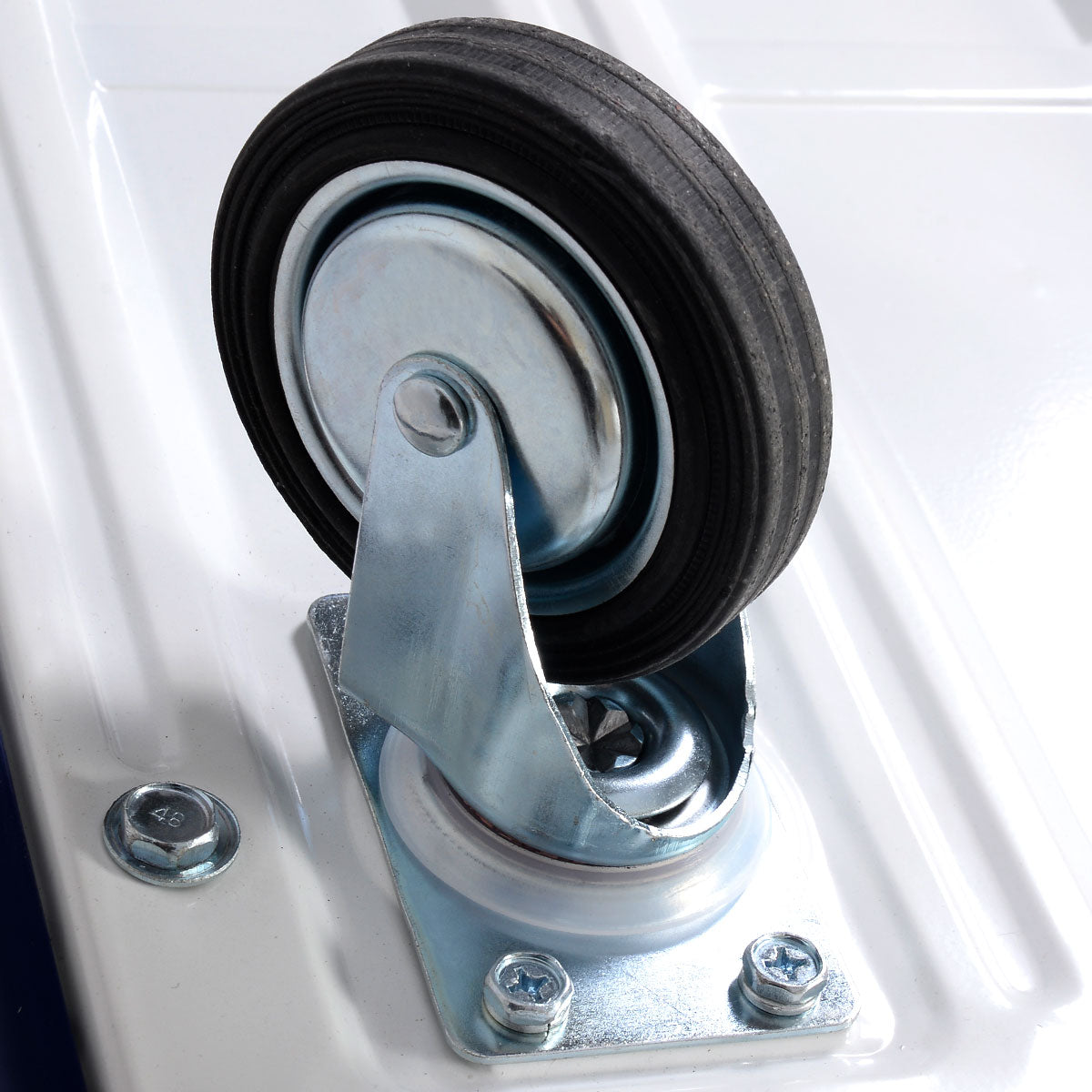 Close-up of a black rubber wheel and metal bracket on the garden cart