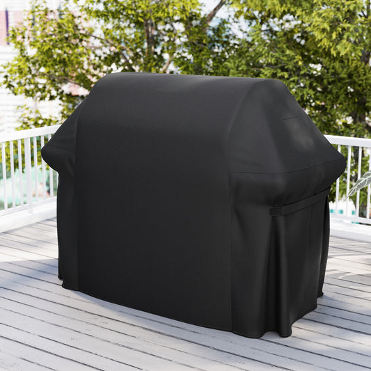 The outdoor grill cover draped over a barbecue on a wooden deck with trees in the background