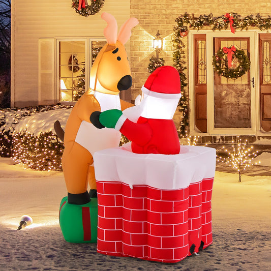 The christmas inflatable displayed outside a house with snowy ground and festive lights